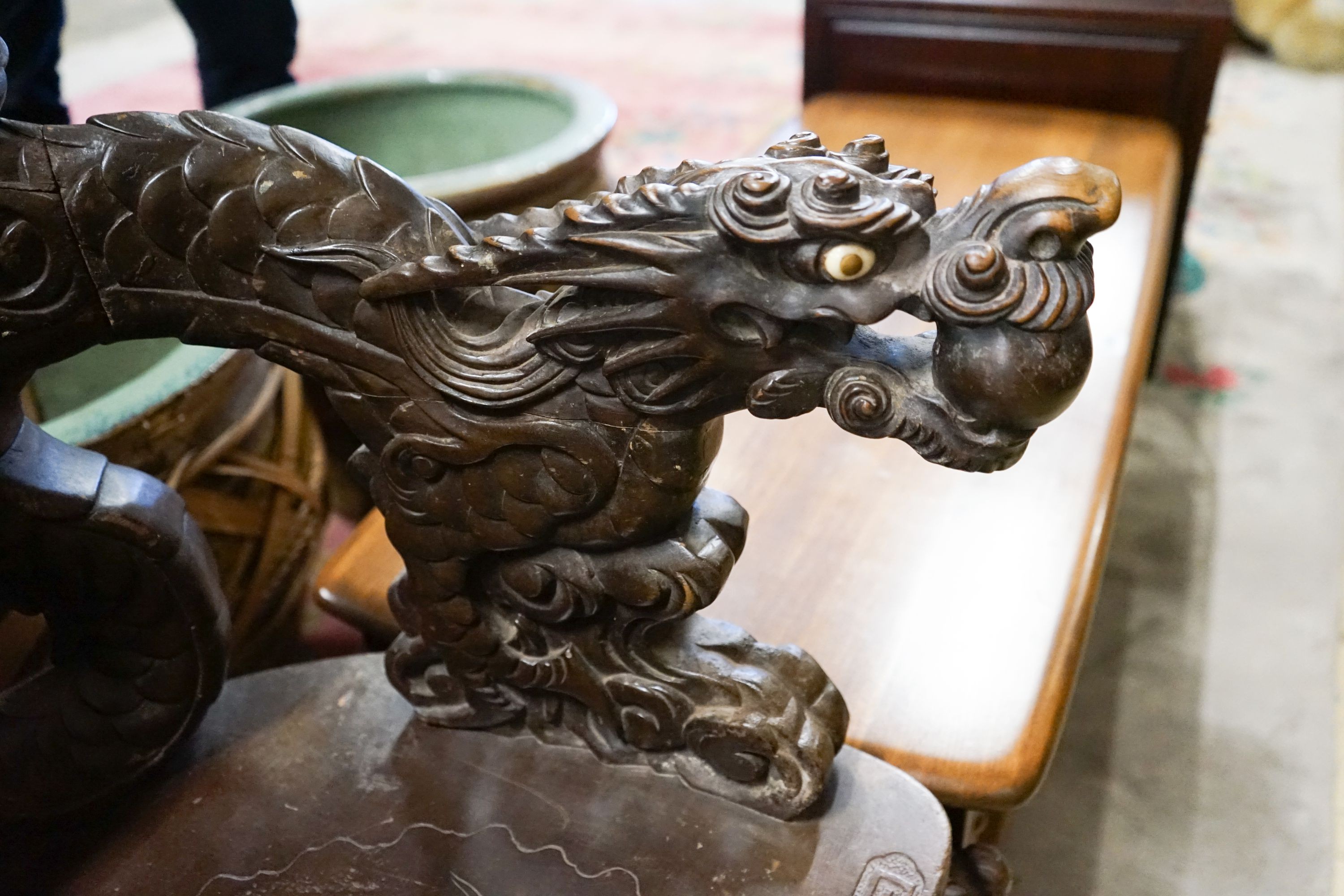 A Chinese carved hardwood 'dragon' elbow chair, width 68cm, depth 47cm, height 88cm